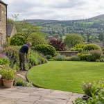 Well-kept lawn and perennial border in an Ilkley garden.